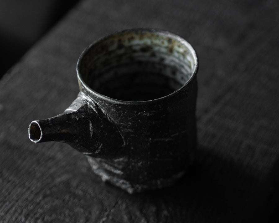 Carved Tea Pourer
